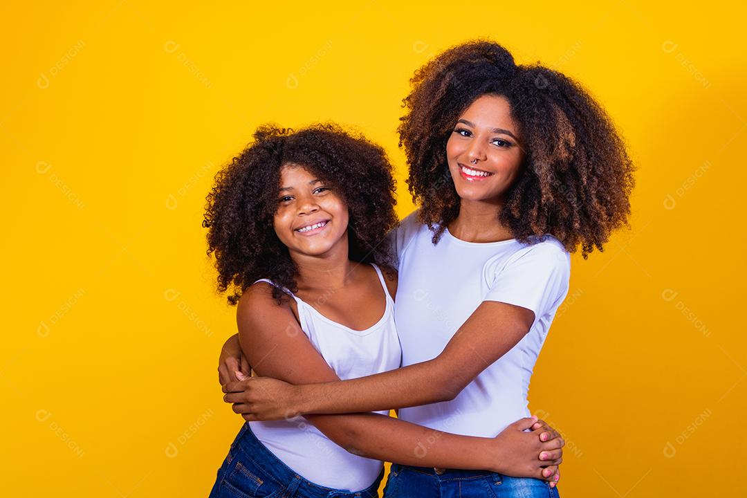 Adorable and sweet young woman hugging her mother