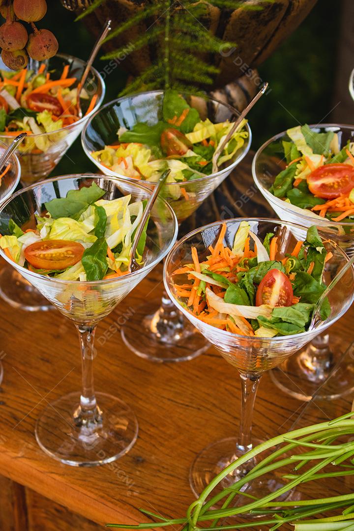 salad appetizers in small containers at tasting