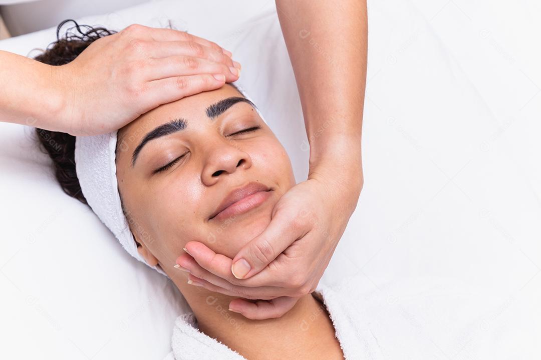 Woman getting massage treatment in beauty salon