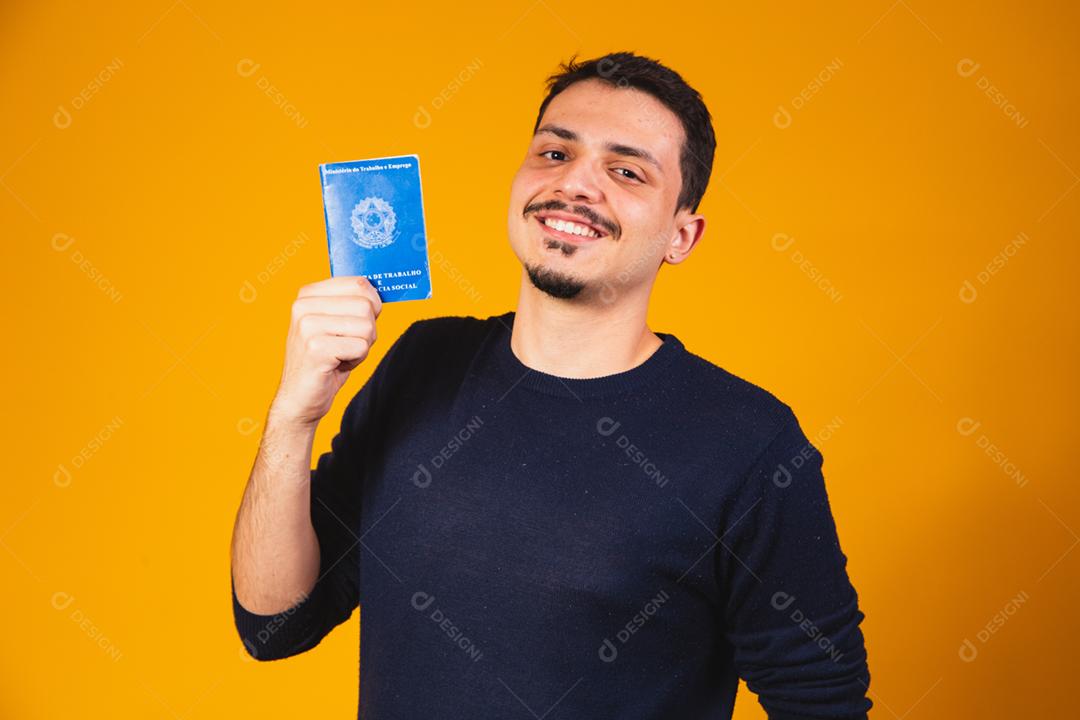 Brazilian man holding a social work card