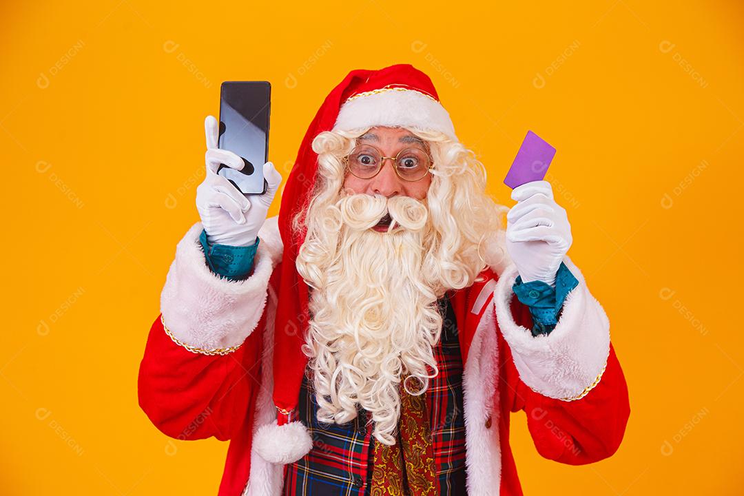 Santa Claus using credit card to pay for internet purchases
