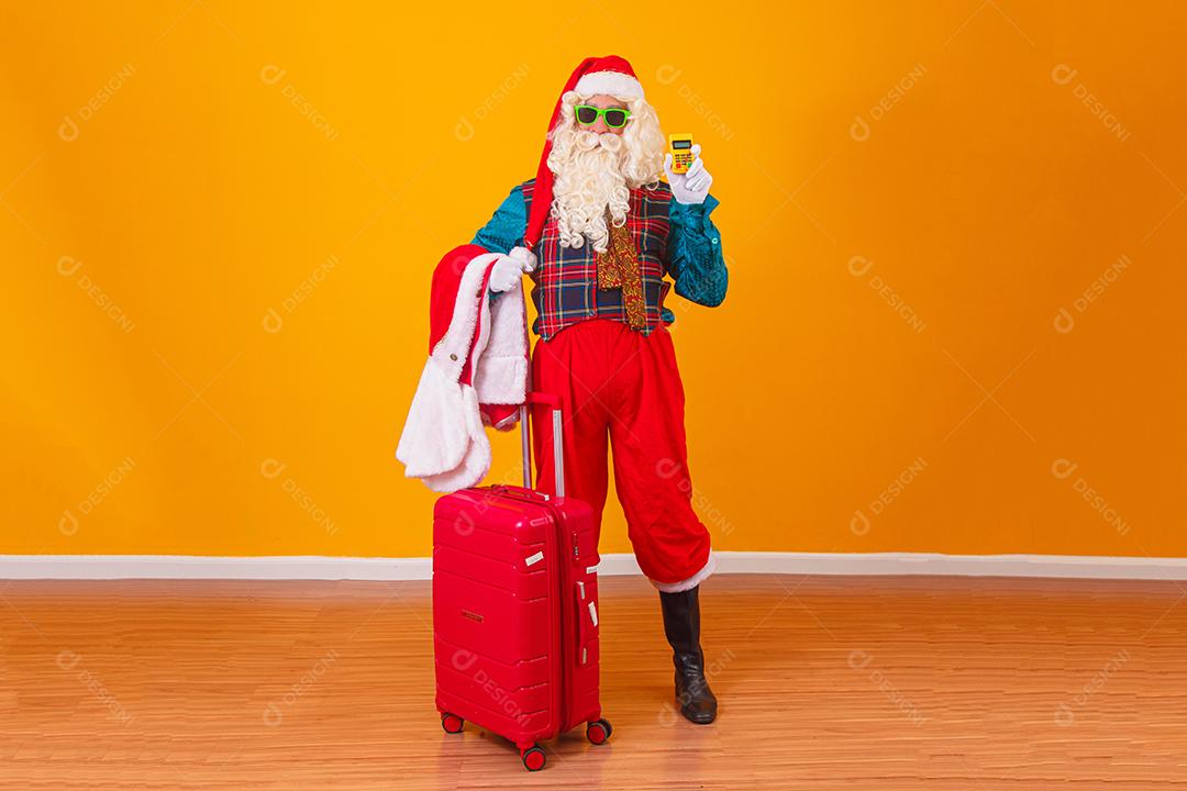 Papai Noel segurando maquininha de cartão