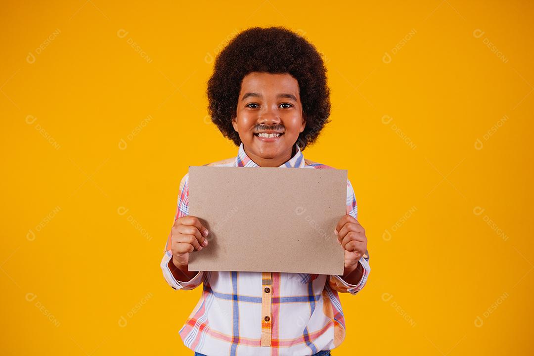 Portrait of an afro boy wearing typical clothes for the Festa Junina