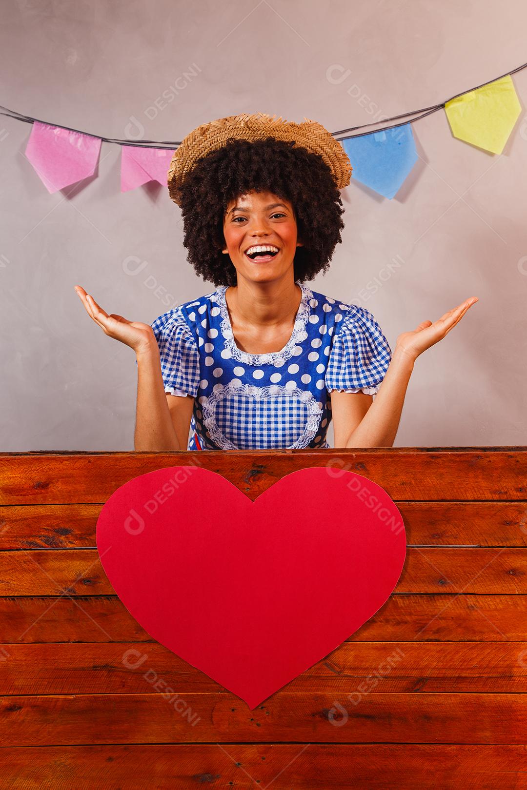 jovem afro vestida para festa junina