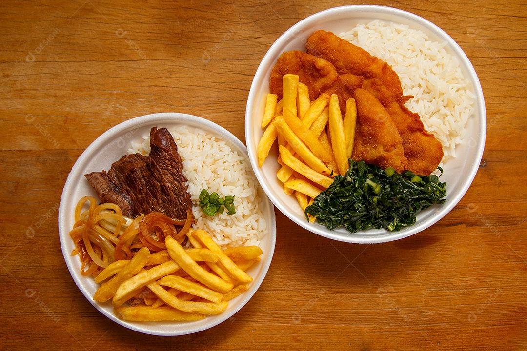 Delicioso prato de frango empanado com arroz e Prato de Arroz feijão batata frita e bife