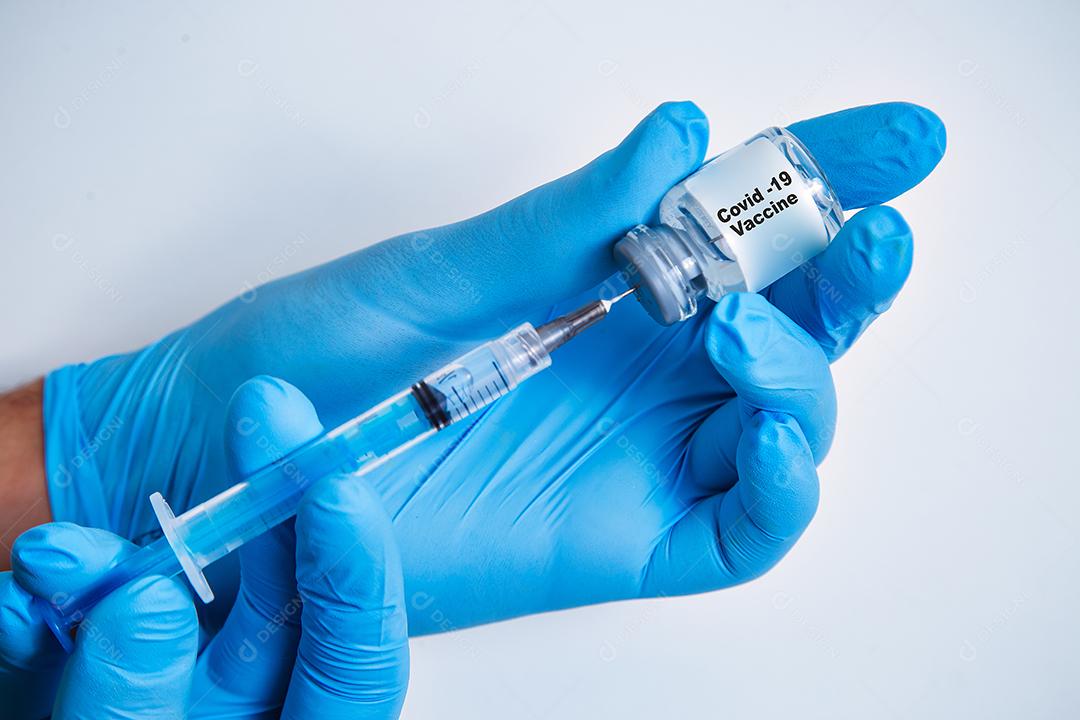 Vaccination against the new Corona Virus Vacine-Covid19: A syringe being prepared with Vaccine-Covid 19.