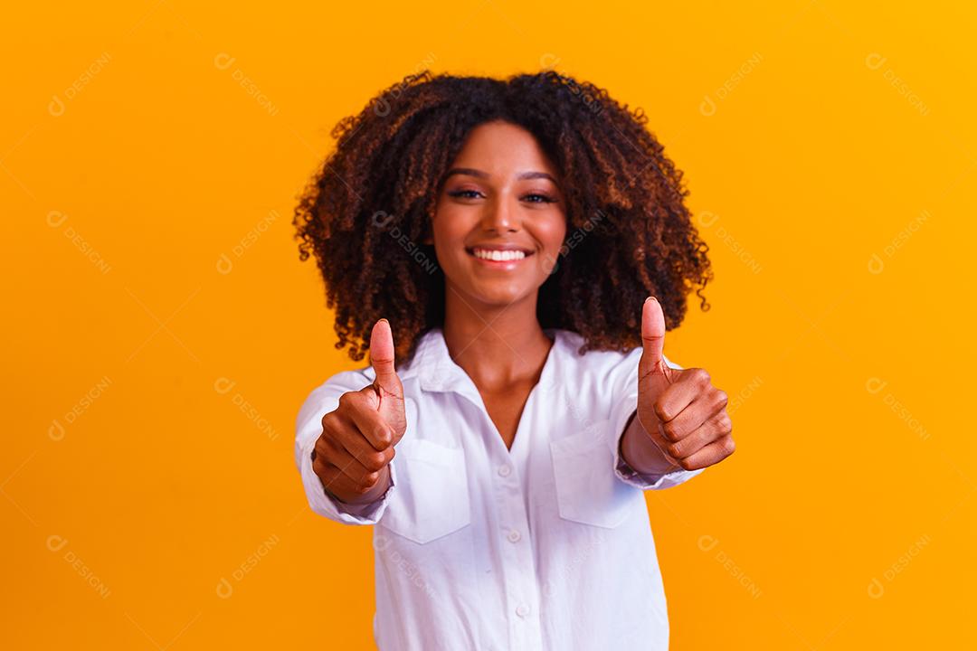 Portrait of smiling beautiful young afro woman thumbs up. brazilian girl.