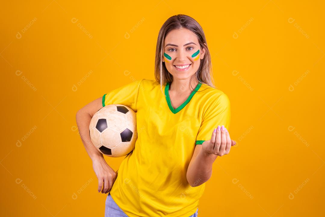 Young Brazilian female supporter with a soccer ball