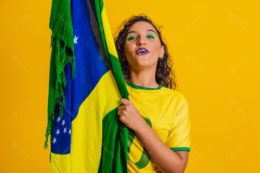 Brazilian fan. wearing the brazilian flag in a portrait, brazilian
