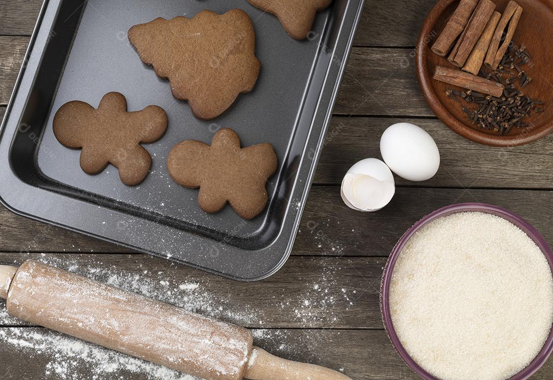 Traditional christmas gingerbread cookies with ingredients over