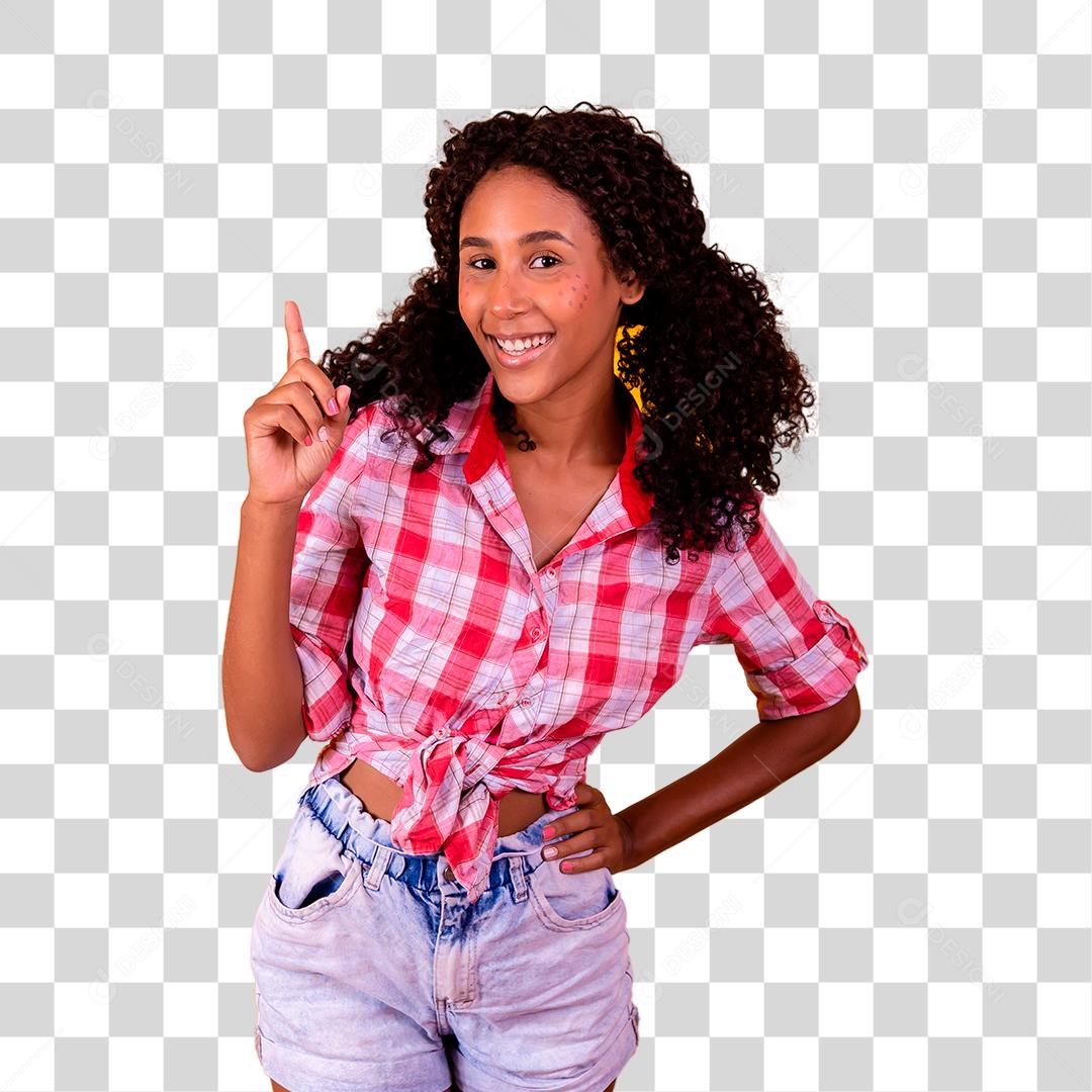 Linda jovem morena vestida para festa junina apontando para cima São João