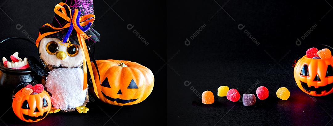 Decoração de feliz dia das bruxas em fundo preto. Abóbora, doces