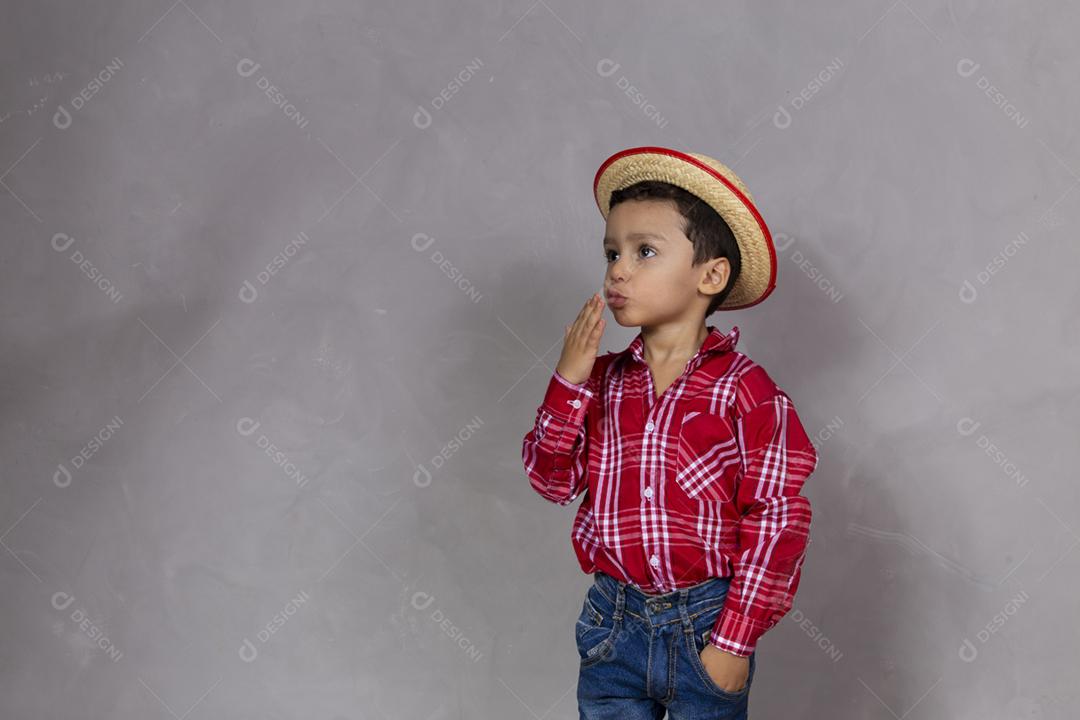 Cute little boy wearing typical clothes for Festa Junina