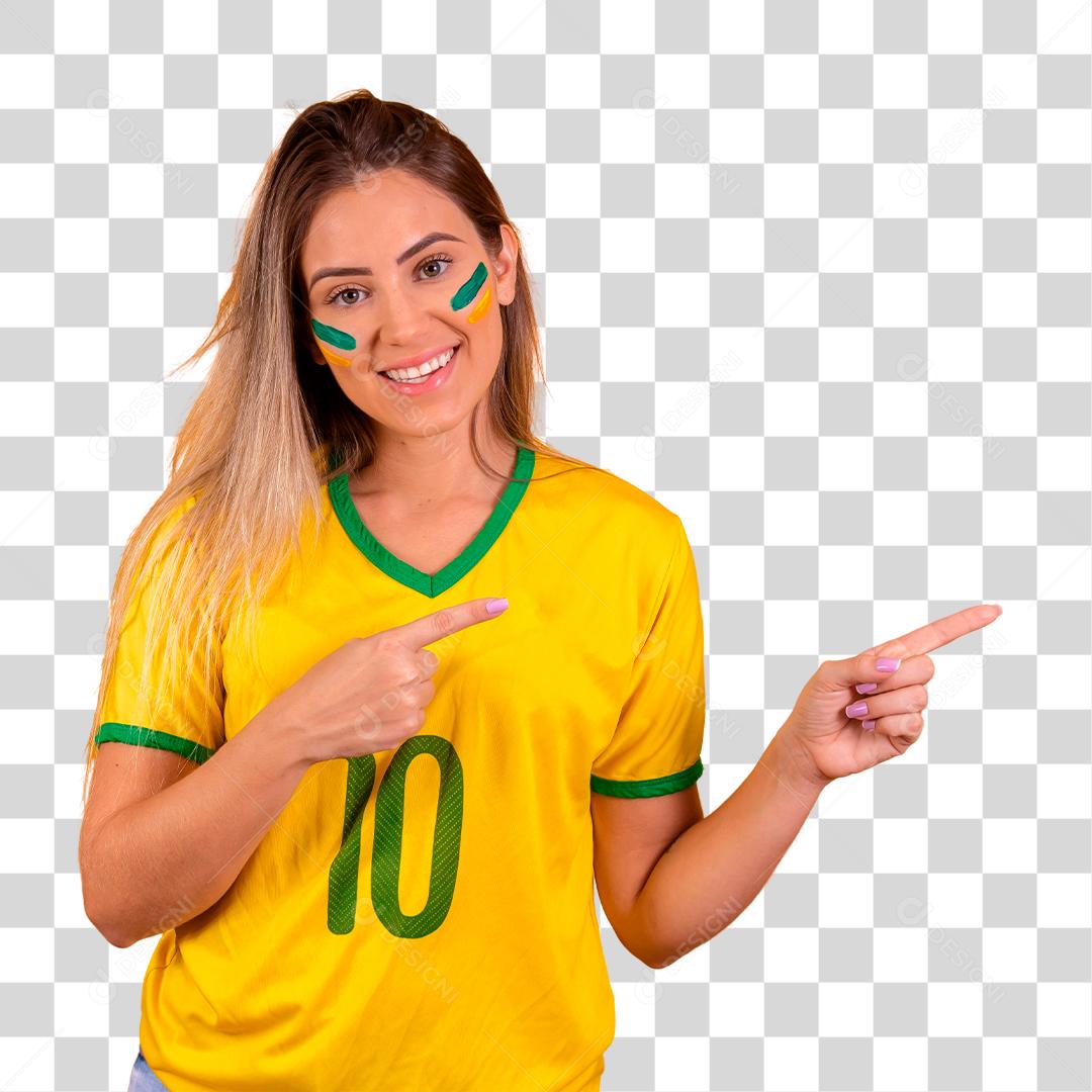 Young Brazilian female cheerleader pointing to the side