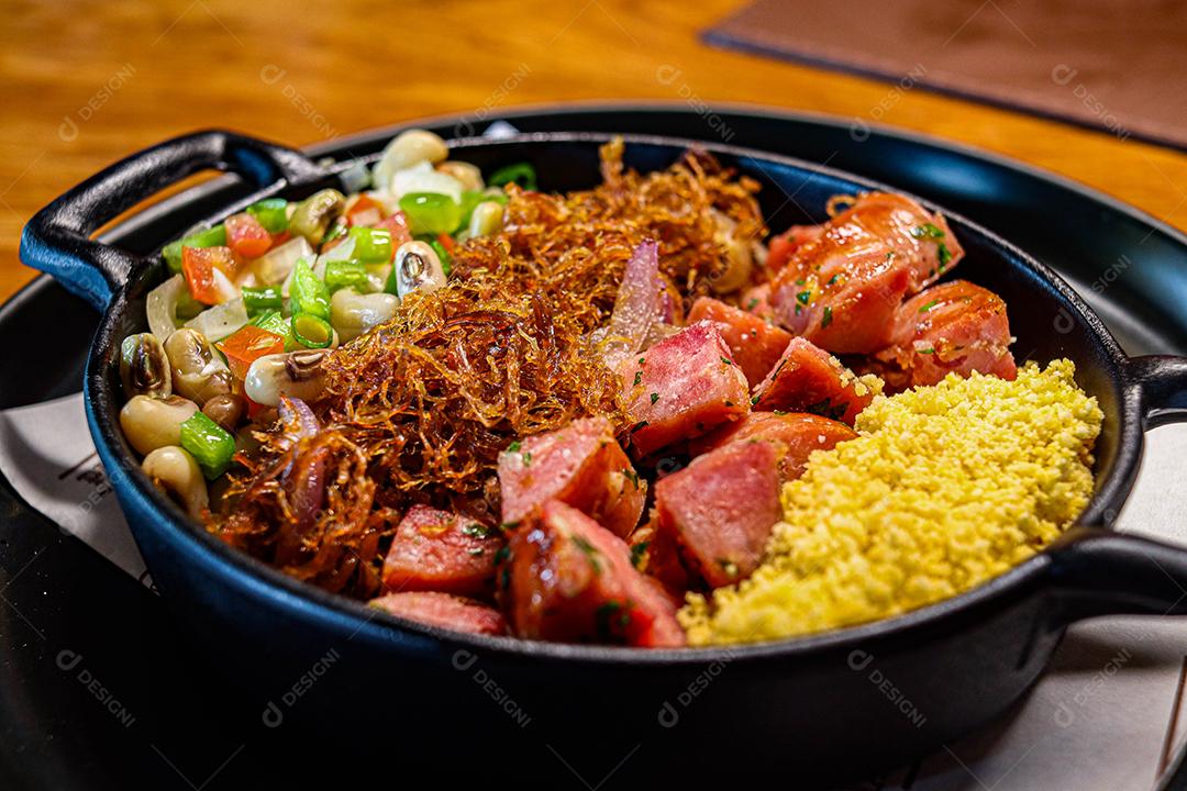 Food pan with couscous, shredded meat, linguicinha and vegetables