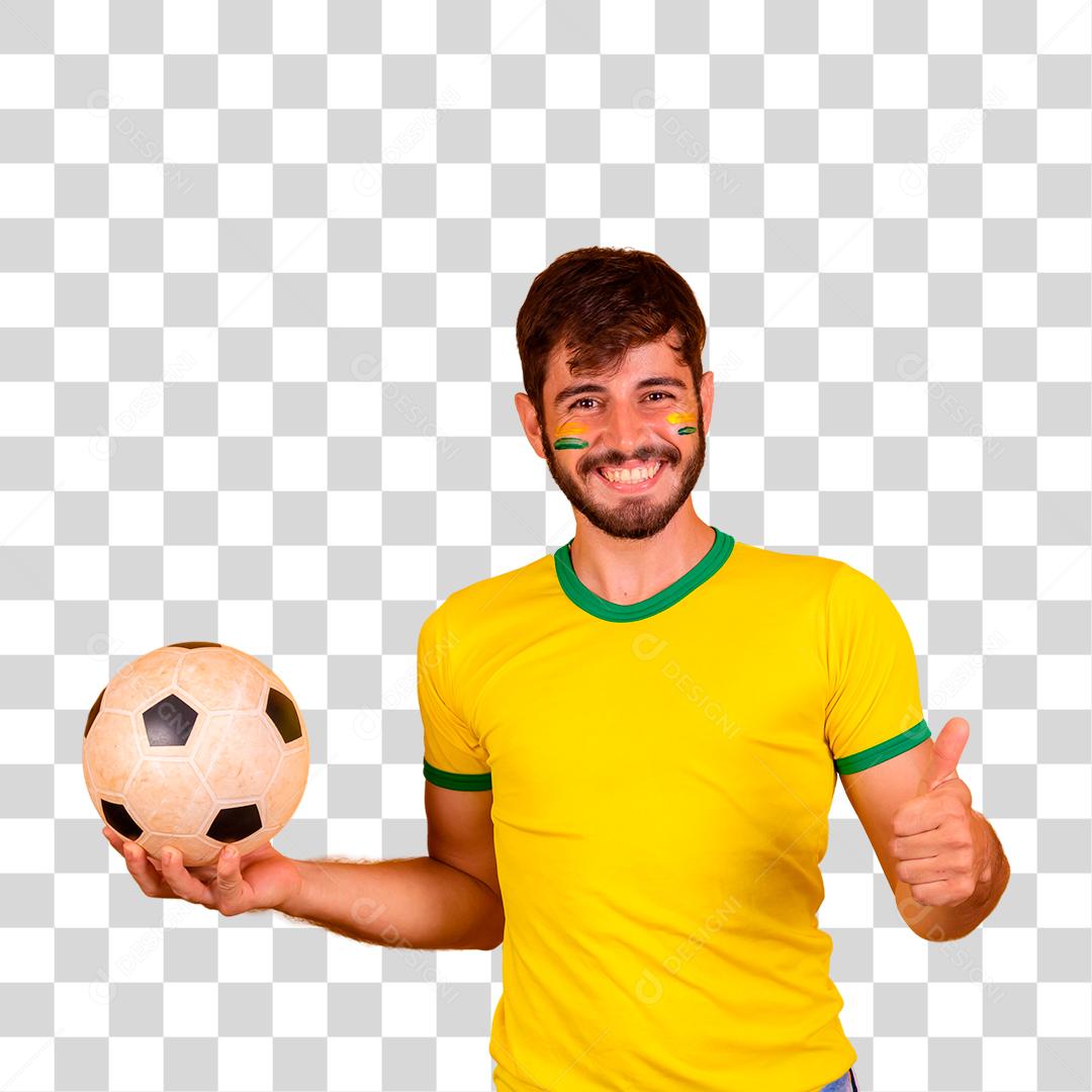 Homem jovem torcedor brasileiro com uma bola de futebol