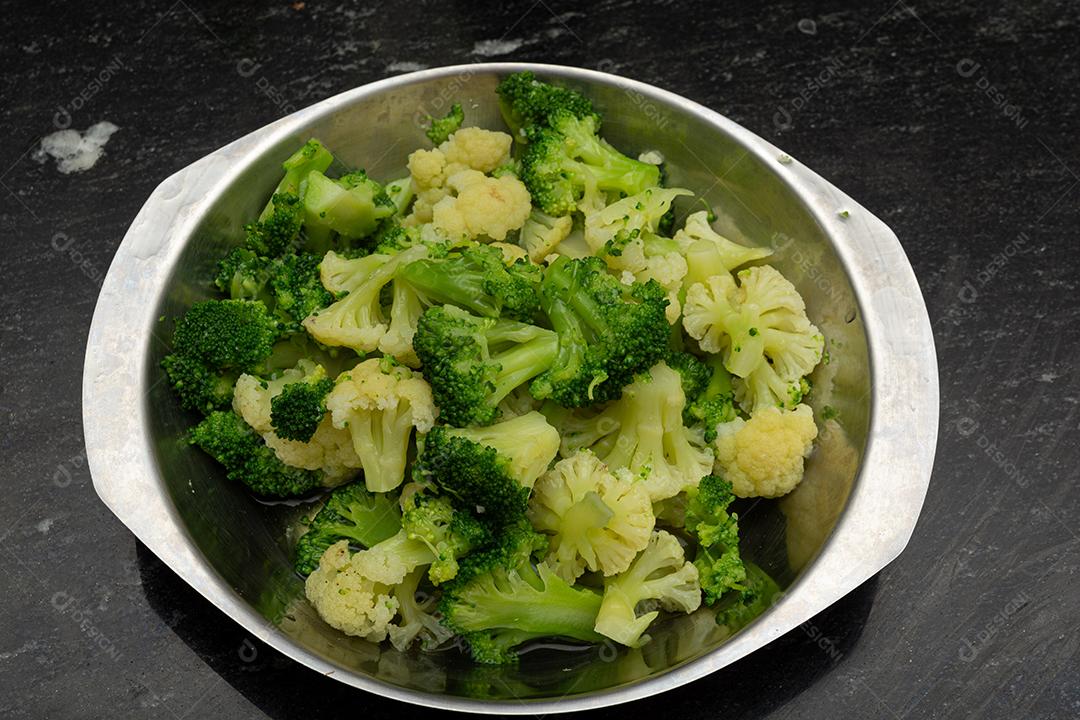 Boiled broccoli over pan. Greenery