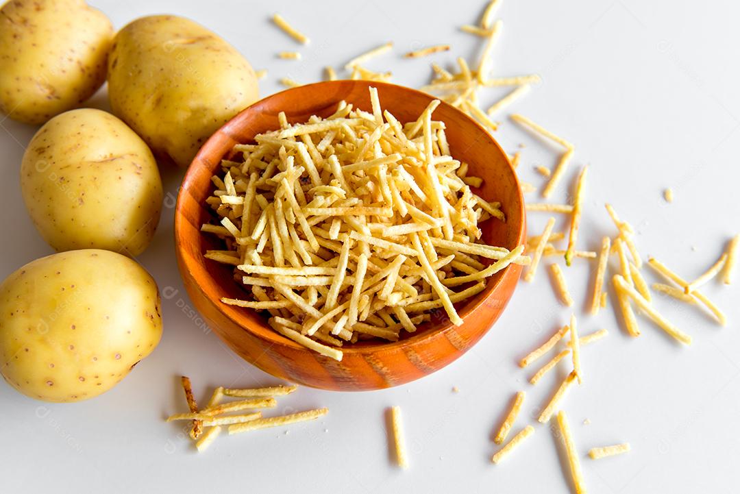 straw fries in bowl on white background.