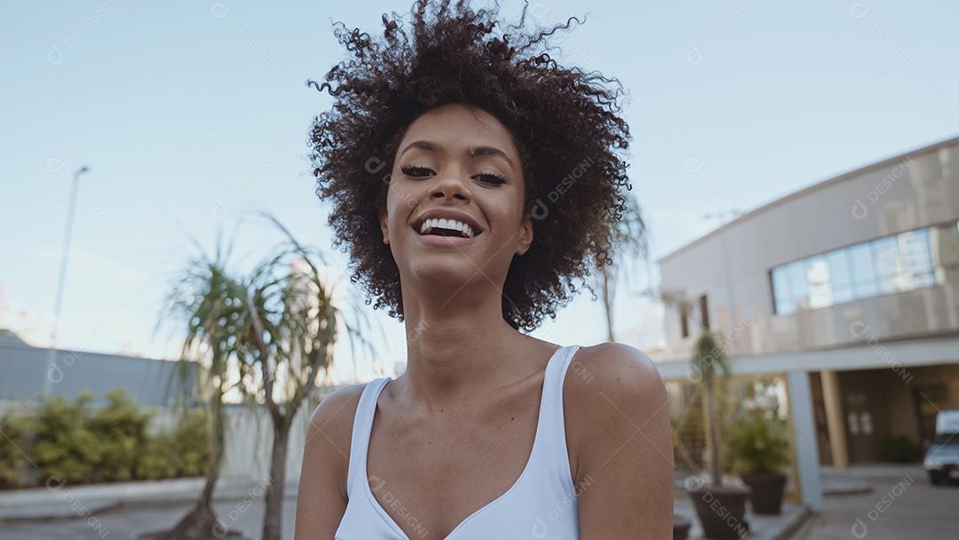 Closeup of a smiling young Latin afro woman. Joy, positive and l