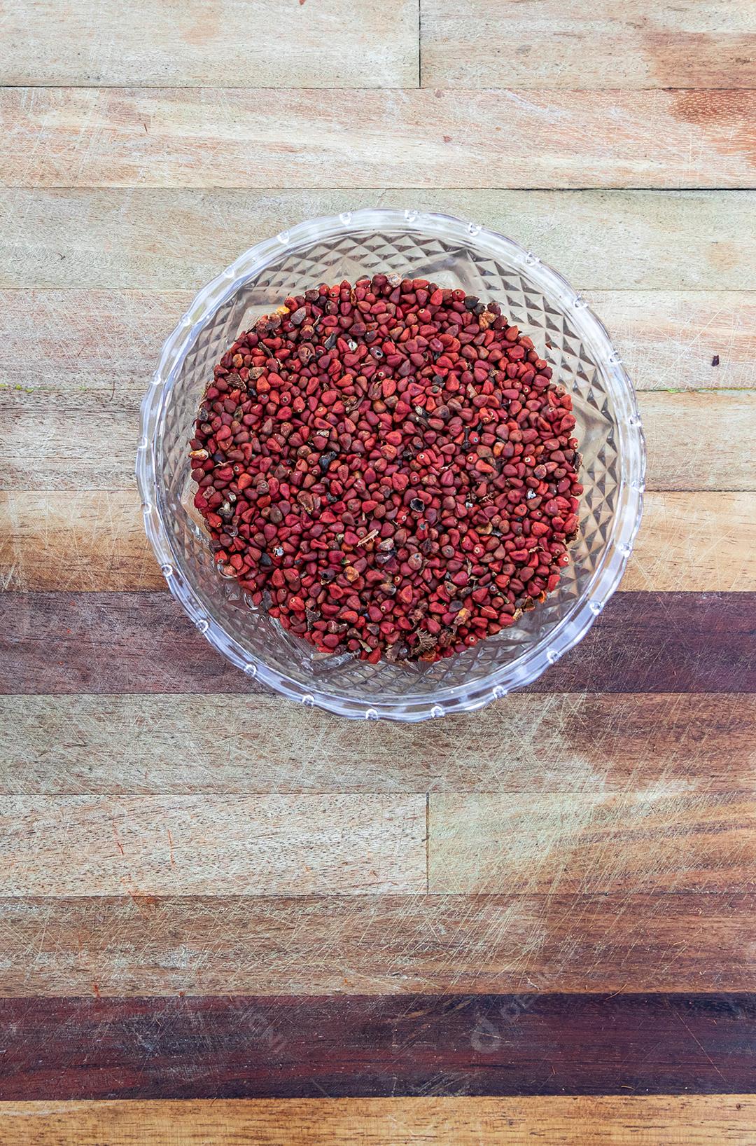 Urucum mesa po vermelho colher fotos imagem