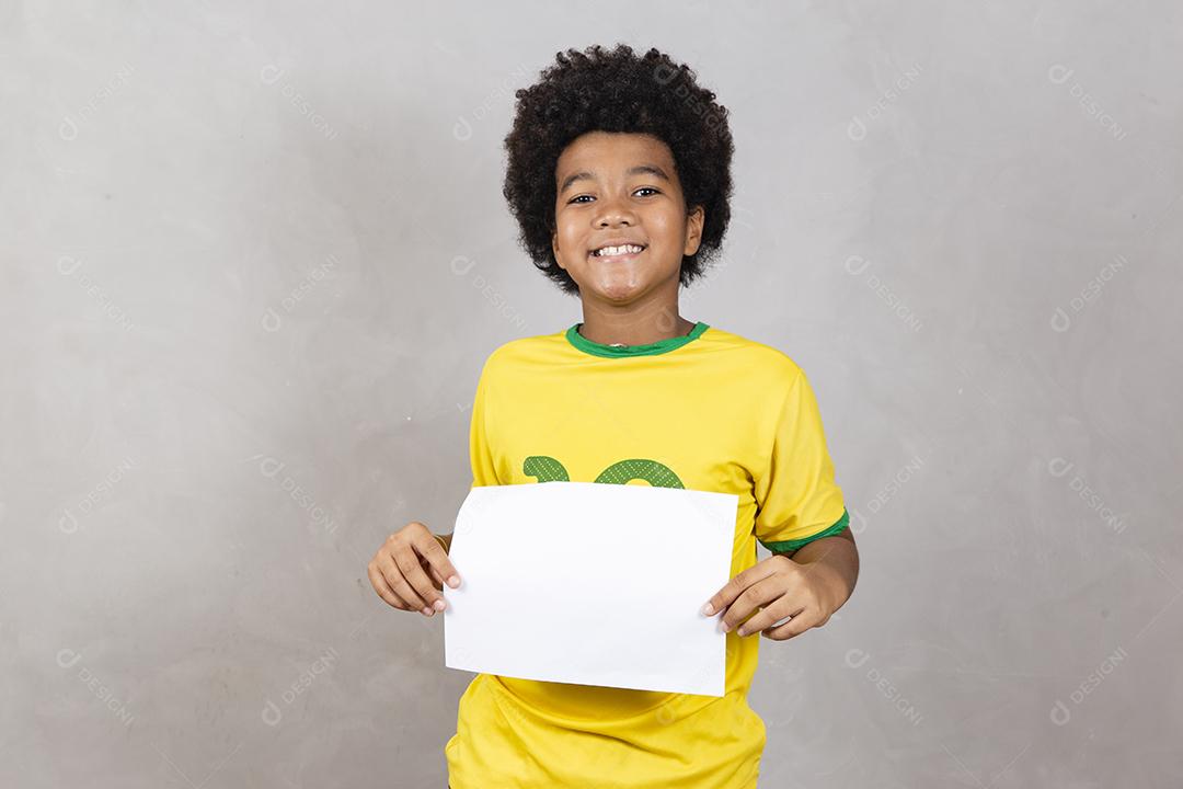 brazilian fan young afro boy holding blank board