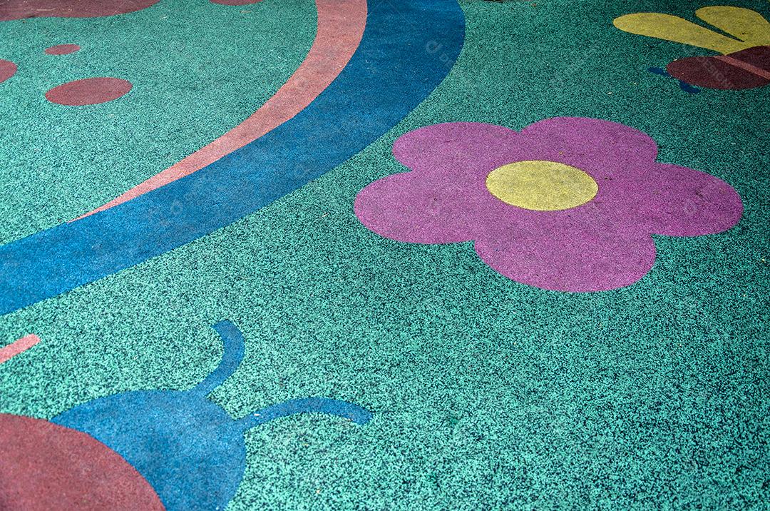 Uma imagem de piso de borracha colorido no campo de jogos