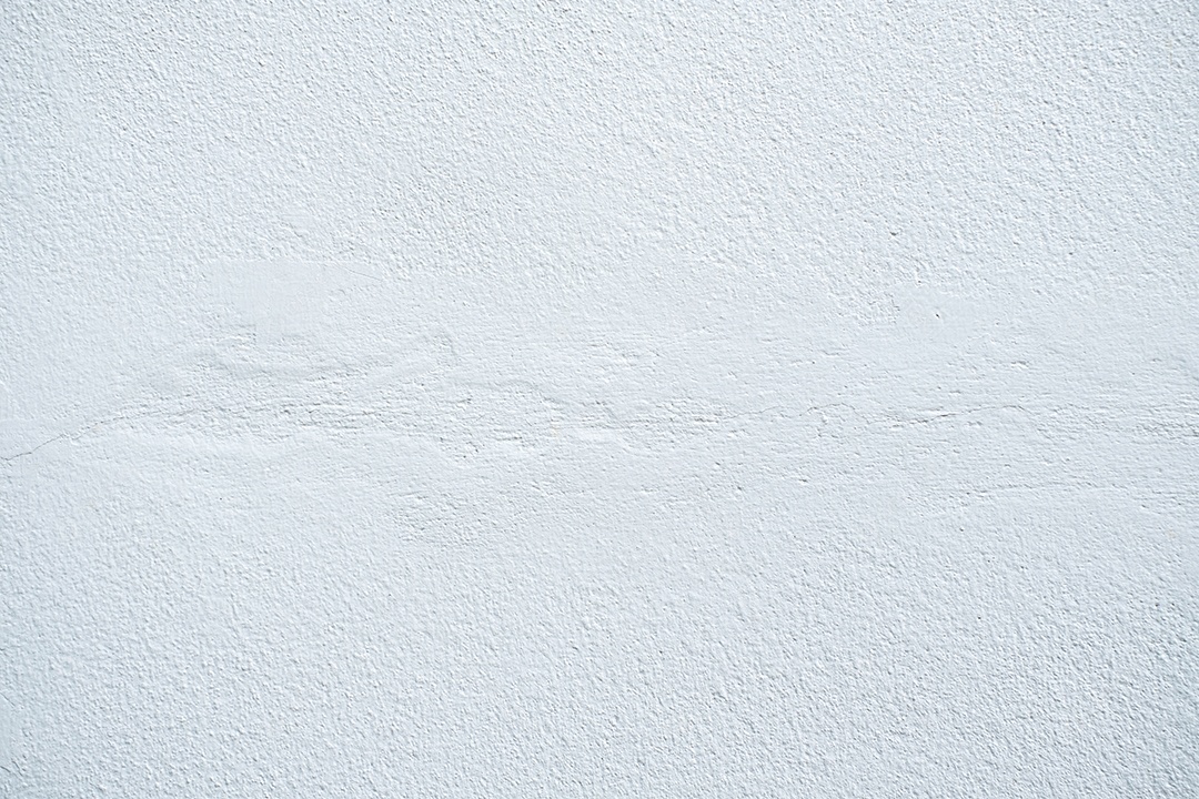 Fundo de textura de parede de estuque de relevo branco áspero. em branco para designer, parede leve, cimento branco