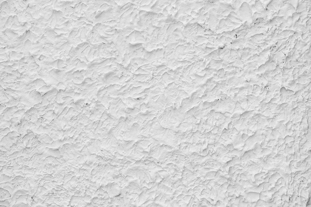 Fundo de textura de parede de estuque de relevo branco áspero. em branco para designer, parede leve, cimento branco