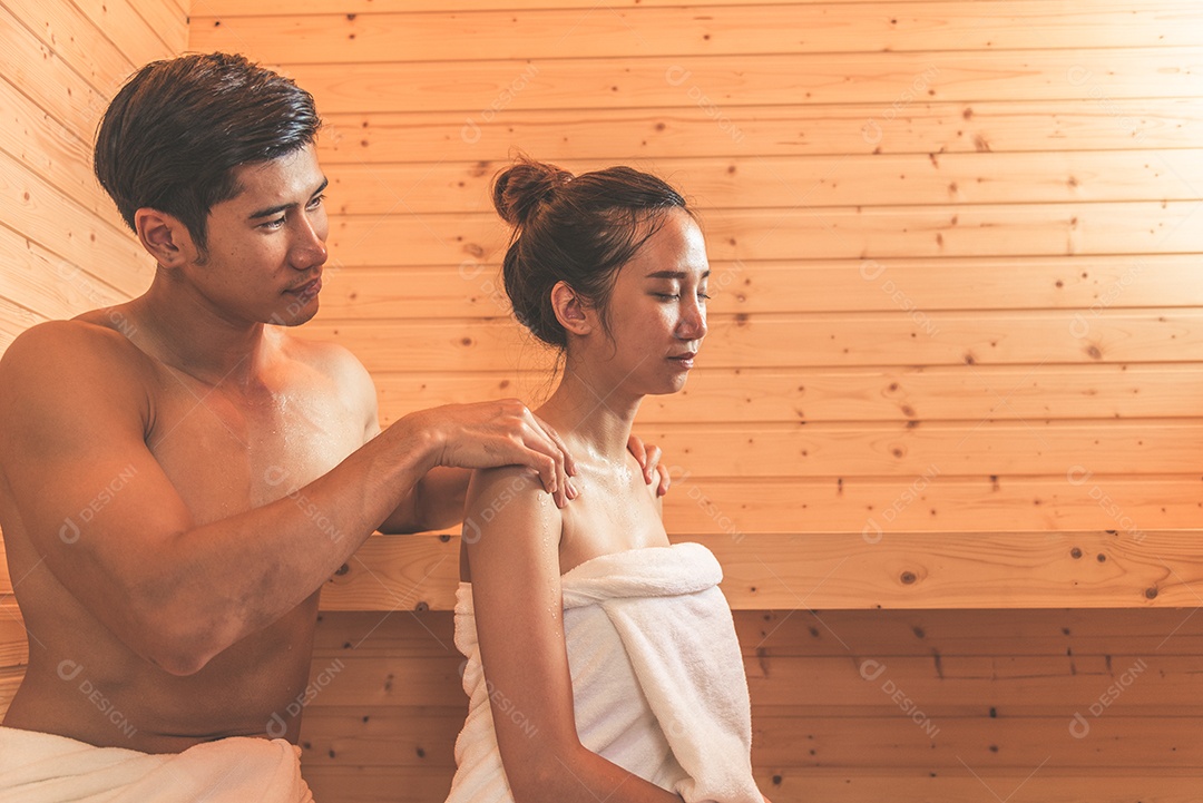 Young Asian couple or lovers have romantic relaxation in sauna.