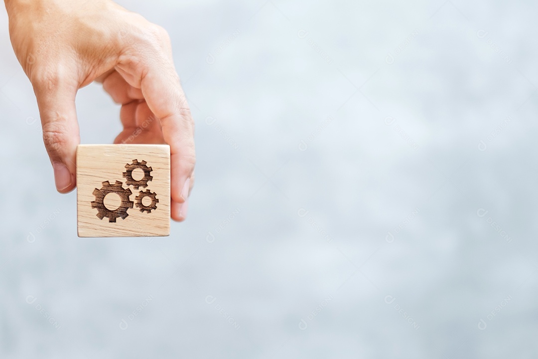 mão segure o bloco de engrenagens com objetivo de negócios, estratégia, trabalho em equipe, alvo, missão, ação, objetivo, brainstorming e conceito de sucesso