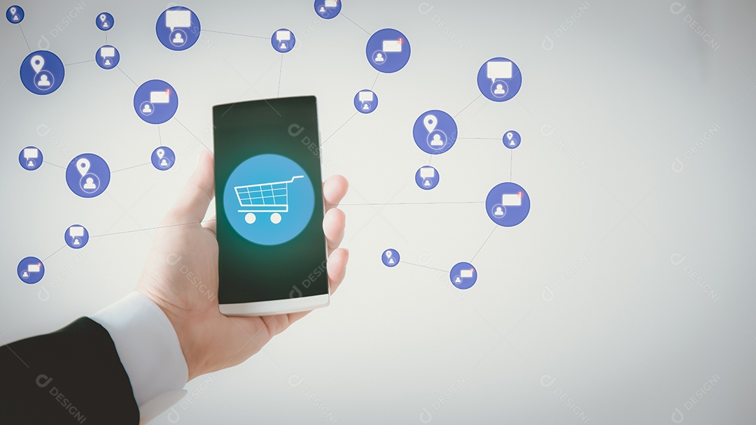 Um telefone celular nas mãos de um jovem empresário