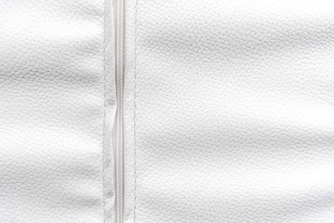 Couro branco com fundo zip. Conceito de papel de parede e textura
