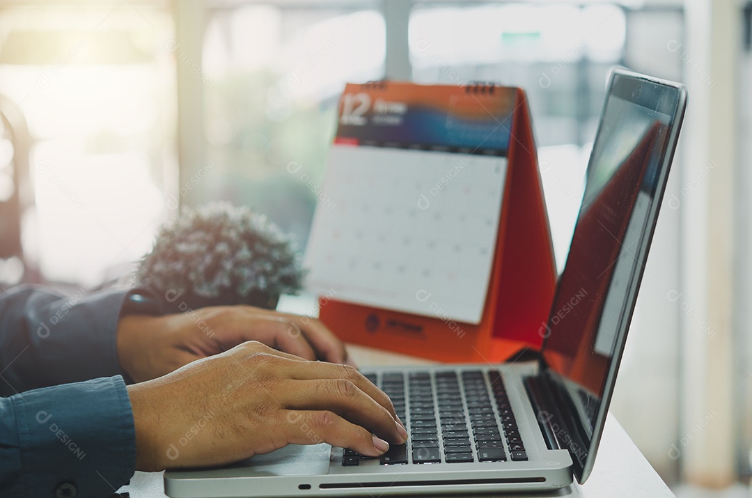 Businessman is typing searches for business information on the internet