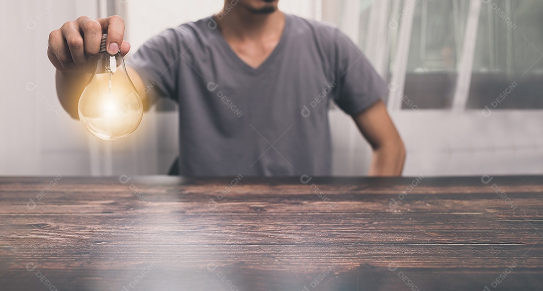 Man holding a lightbulb, looking for ideas, new ideas, illustrations