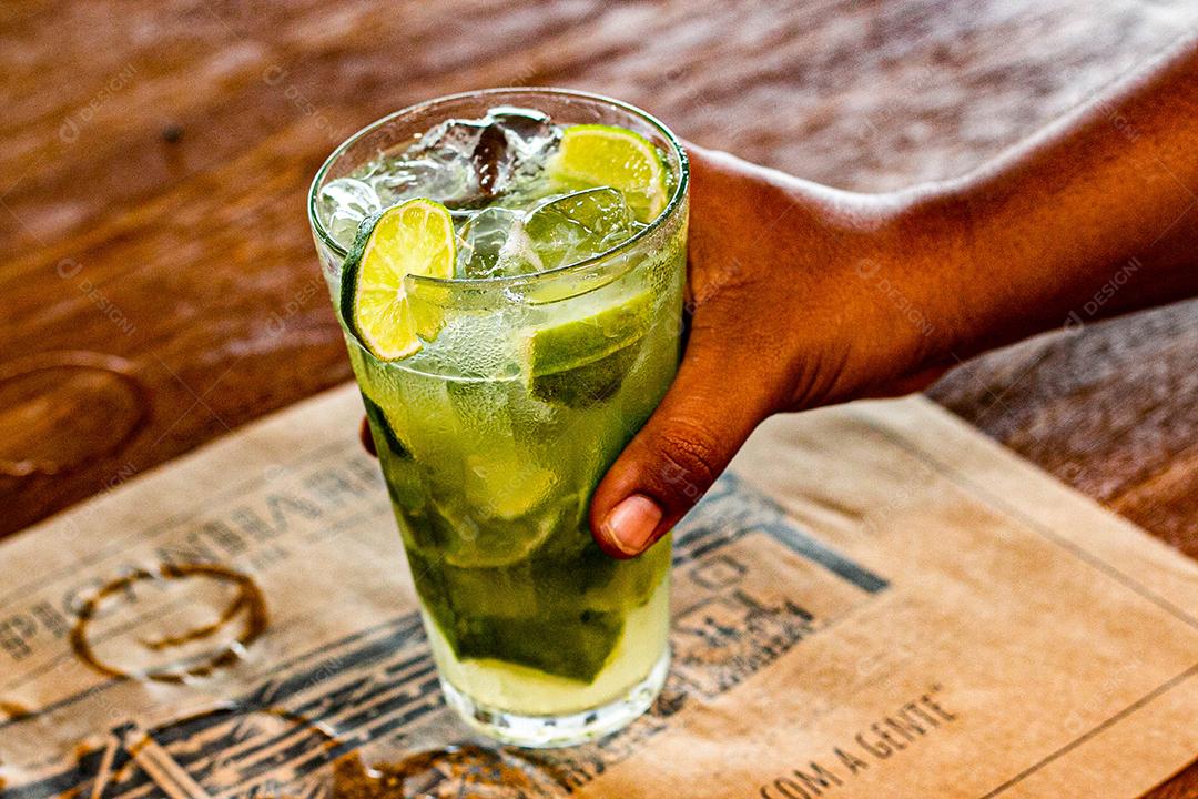 Lemon Caipirinha with ice cubes