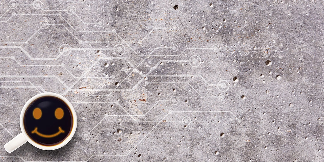 Café no cimento com ícone de rosto sorridente de vista superior do espaço