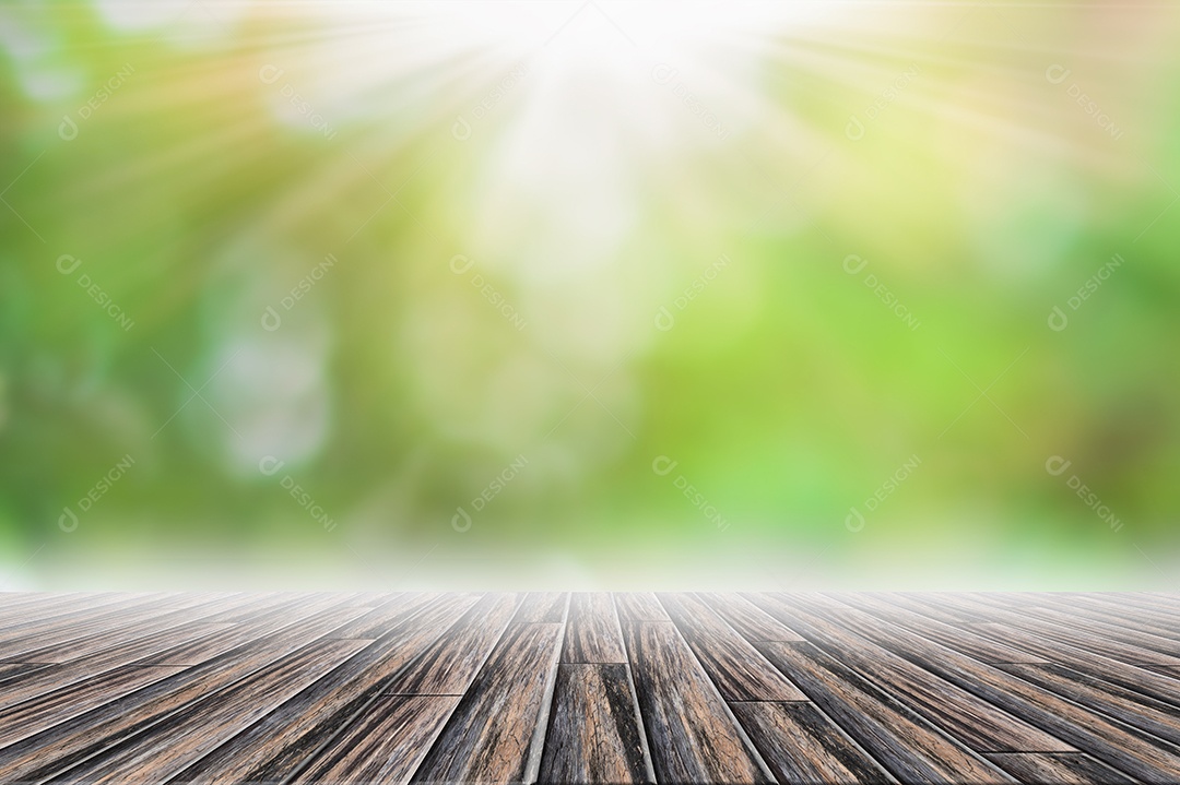 Pano de fundo da cena do piso de madeira Bokeh verde borrão com raio de sol