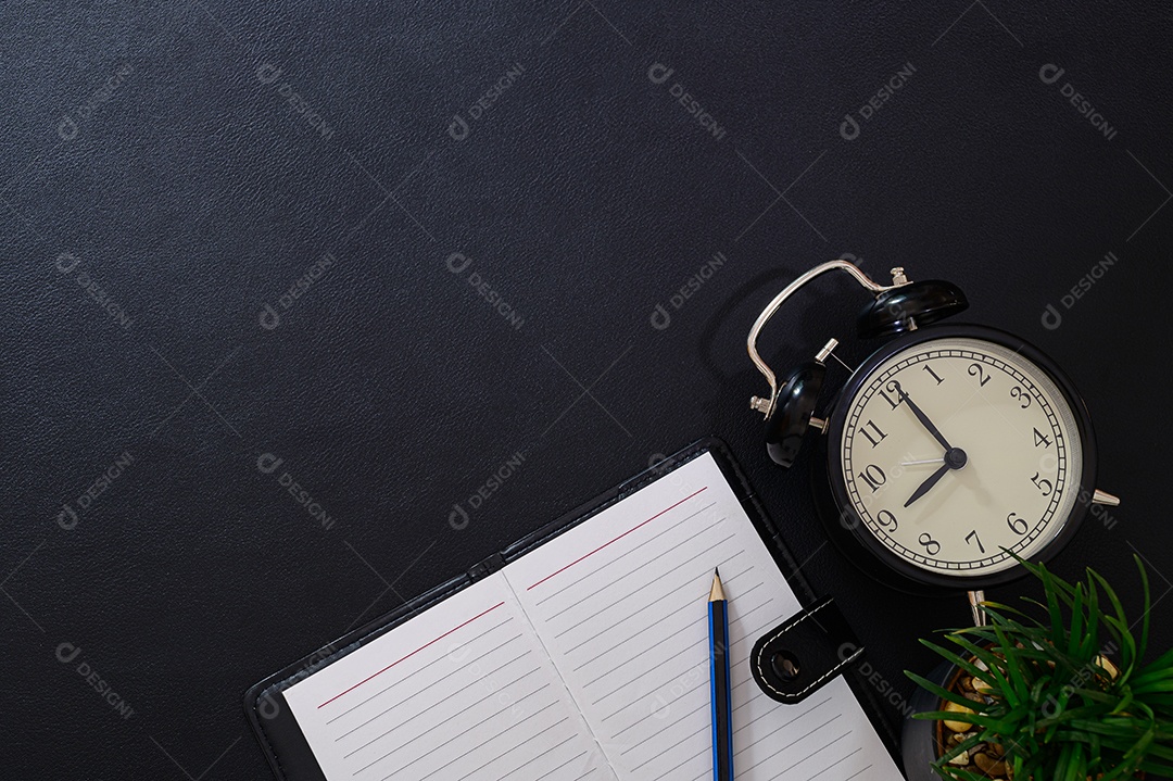 Books notes pencil clocks and coffee beans on table top view