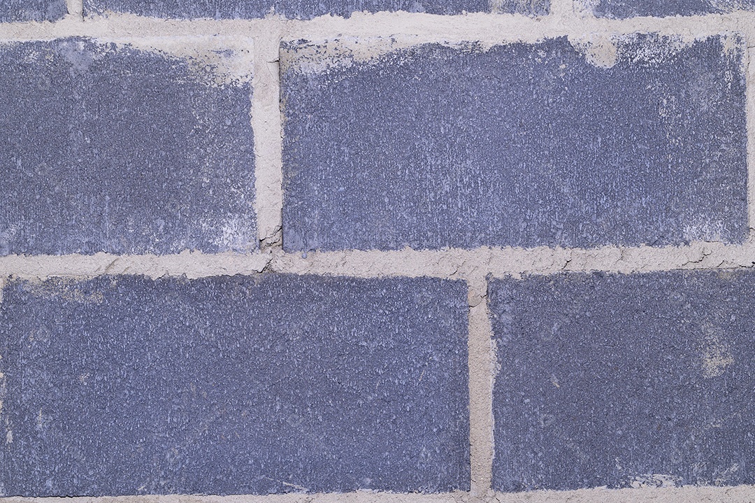 Fundo da parede de tijolos cinza