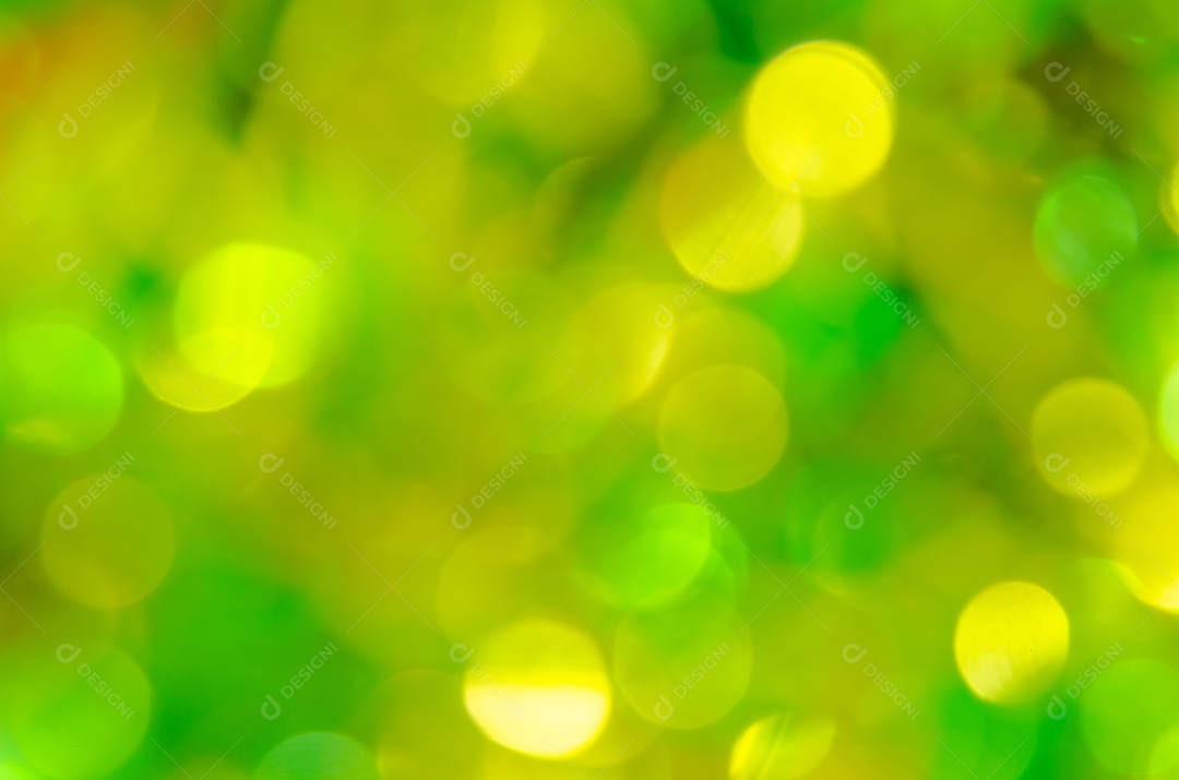 Bokeh amarelo e verde turva abstrato no fundo
