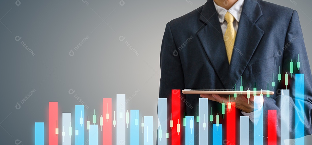 Business man holding a tablet in his hand. Stock exchange market chart concept