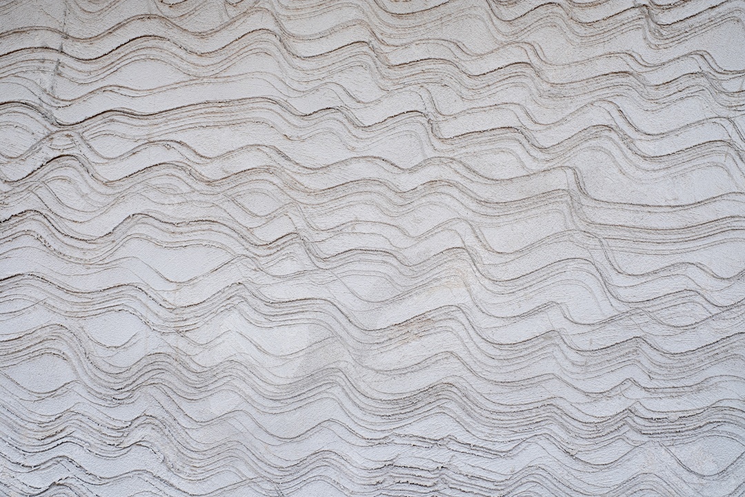 Padrão de onda cinza no fundo da parede texturizada de concreto do trabalhador doméstico