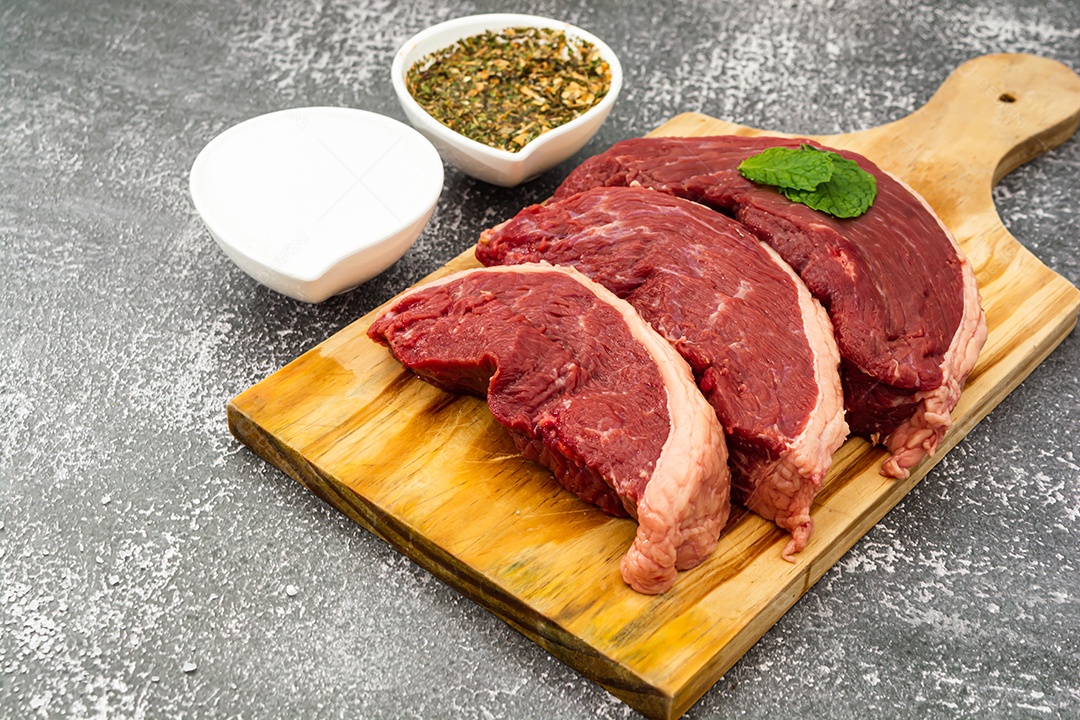 raw sirloin steaks with spices