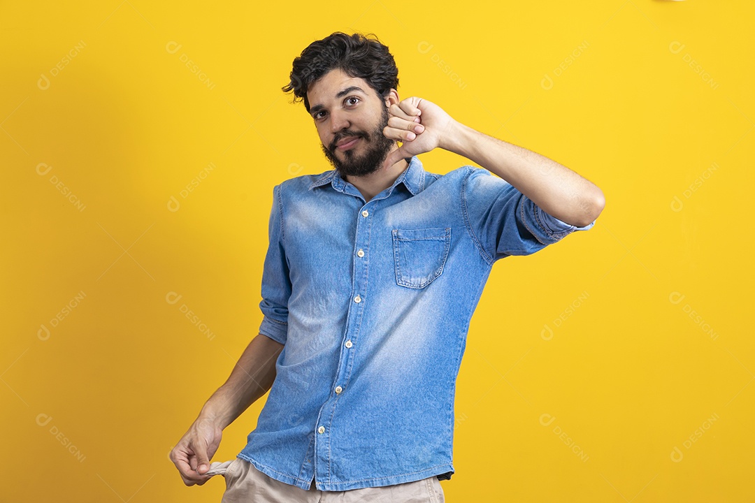 Bearded young man on yellow background