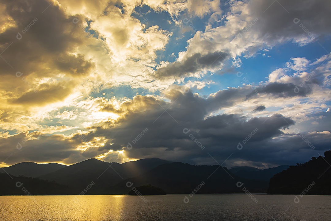 mountain landscape with colorful vivid sunset in cloudy sky