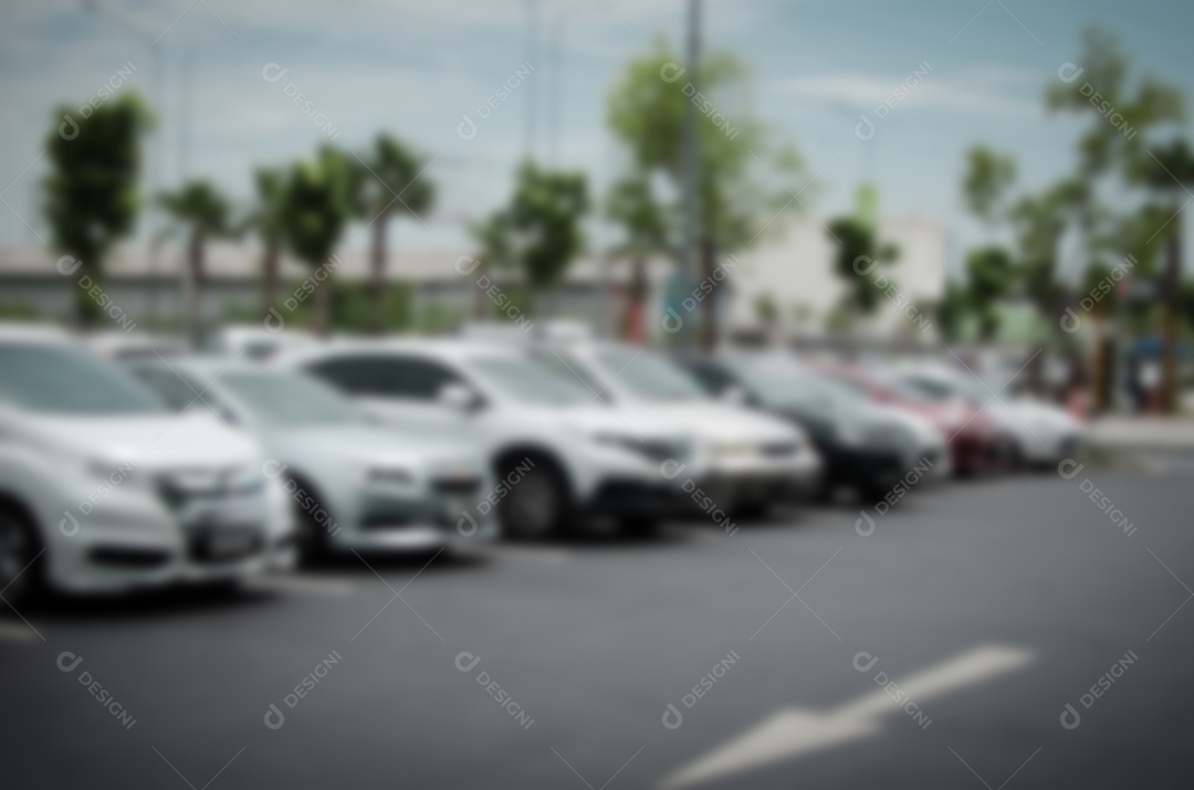 Desfocar o fundo desfocado do parque de estacionamento ao ar livre.