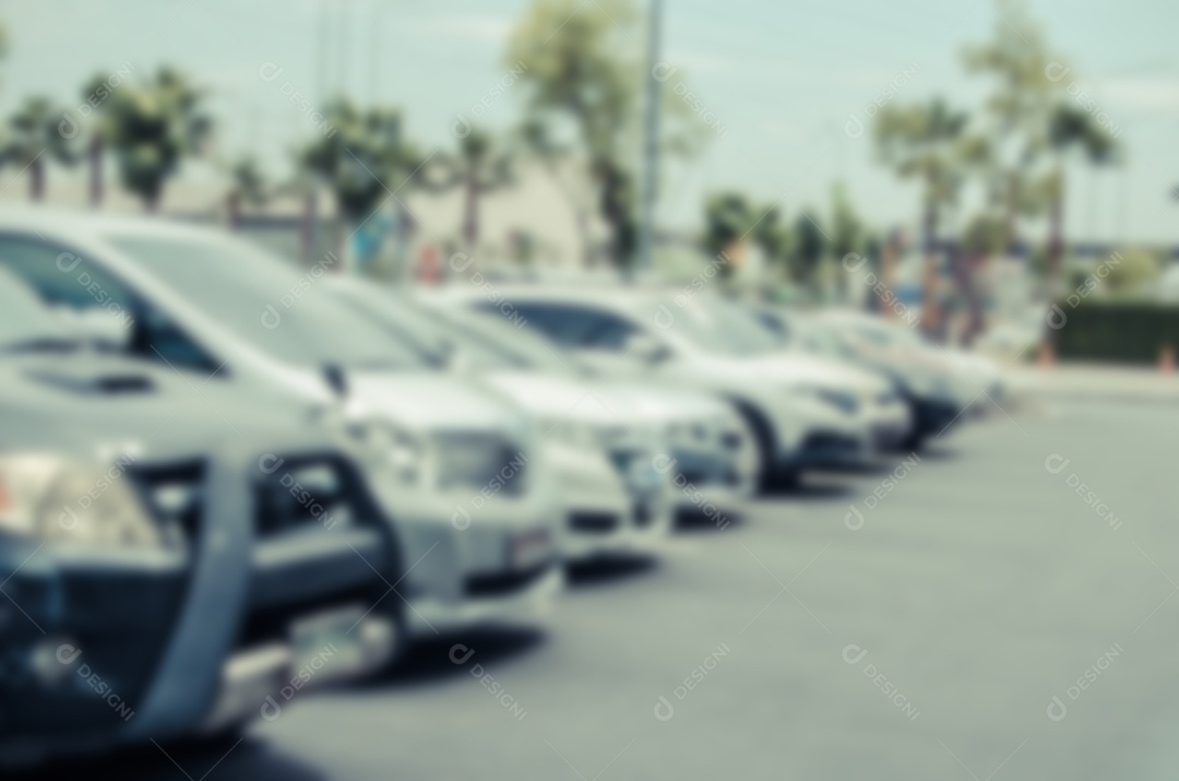 Desfocar o fundo desfocado do parque de estacionamento ao ar livre.