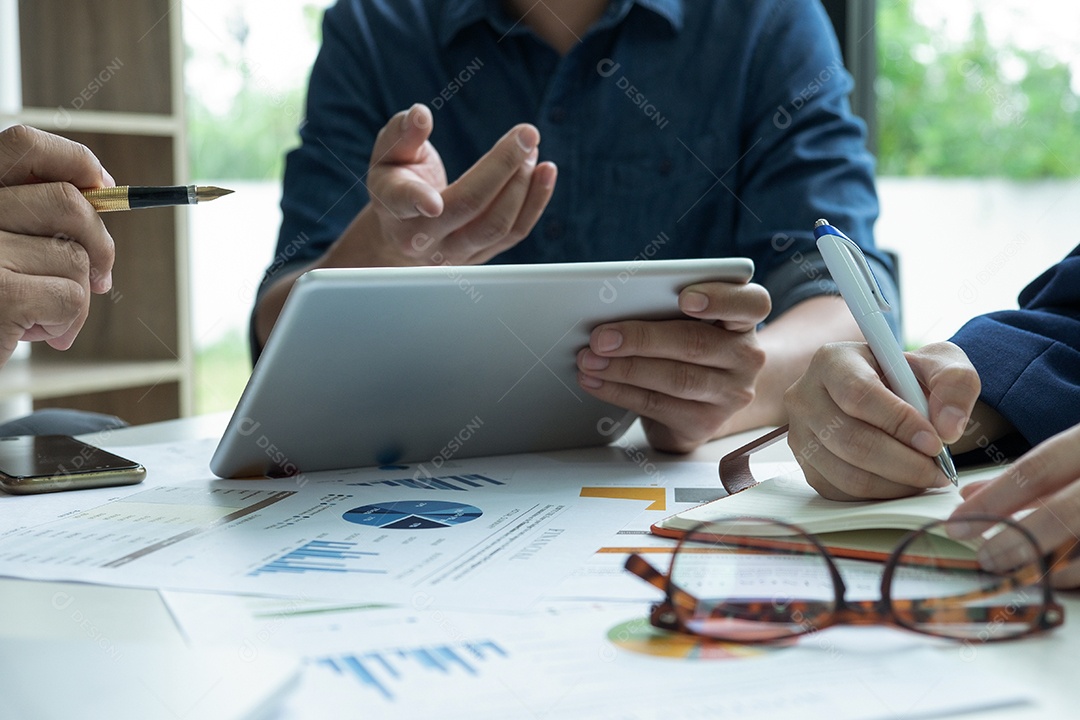 Business Concepts, Management Team is Planning Work to Achieve the Goal. They use tablet and analyze chart data.