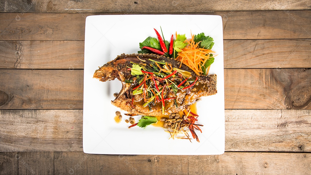 fried fish with fresh herbs and sweet spicy sauce
