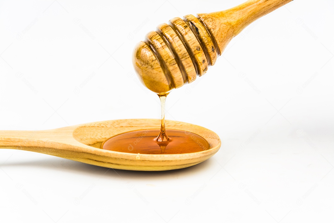 wooden honey ladle on white background